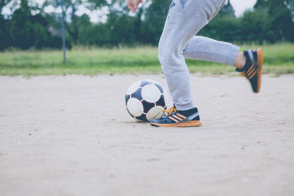 Free Image of Action shot of a soccer ball kick 
