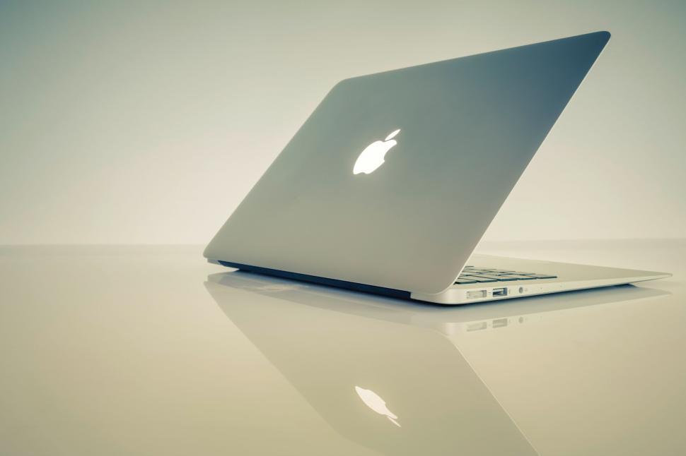 Free Image of Sleek laptop on a minimalist white background 
