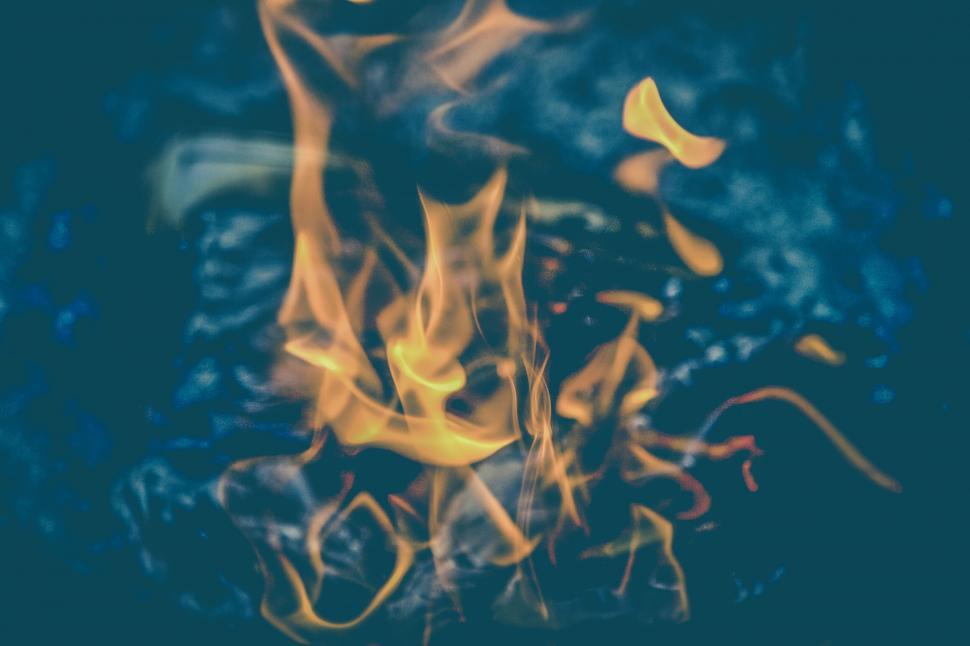 Free Image of Intense flames dancing against a dark background 