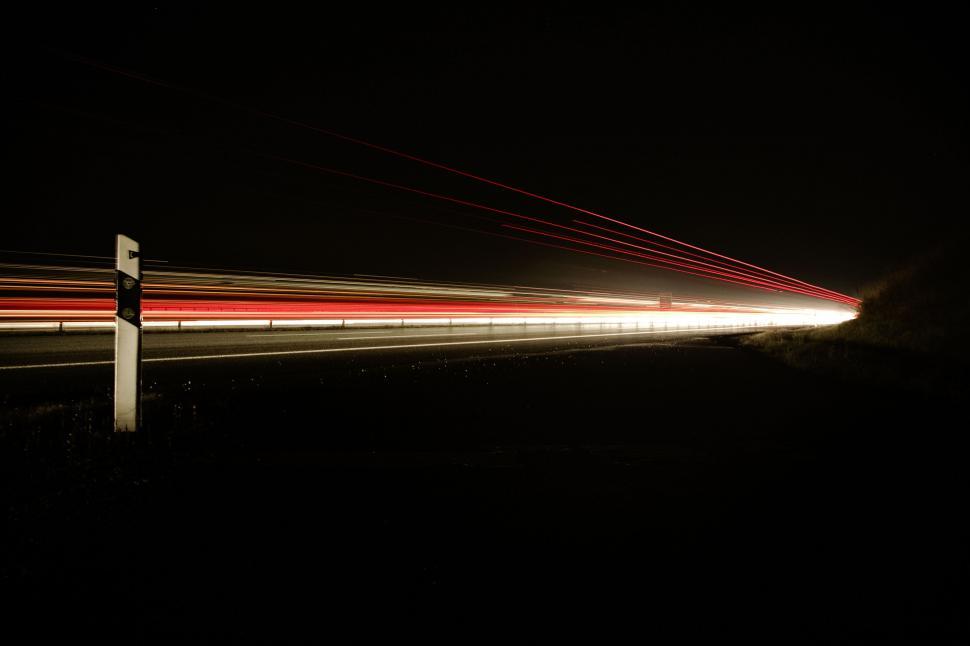 Free Image of Long exposure of highway traffic at night 