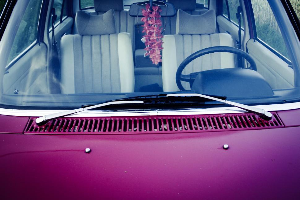 Free Image of Vintage pink car with hanging air freshener 