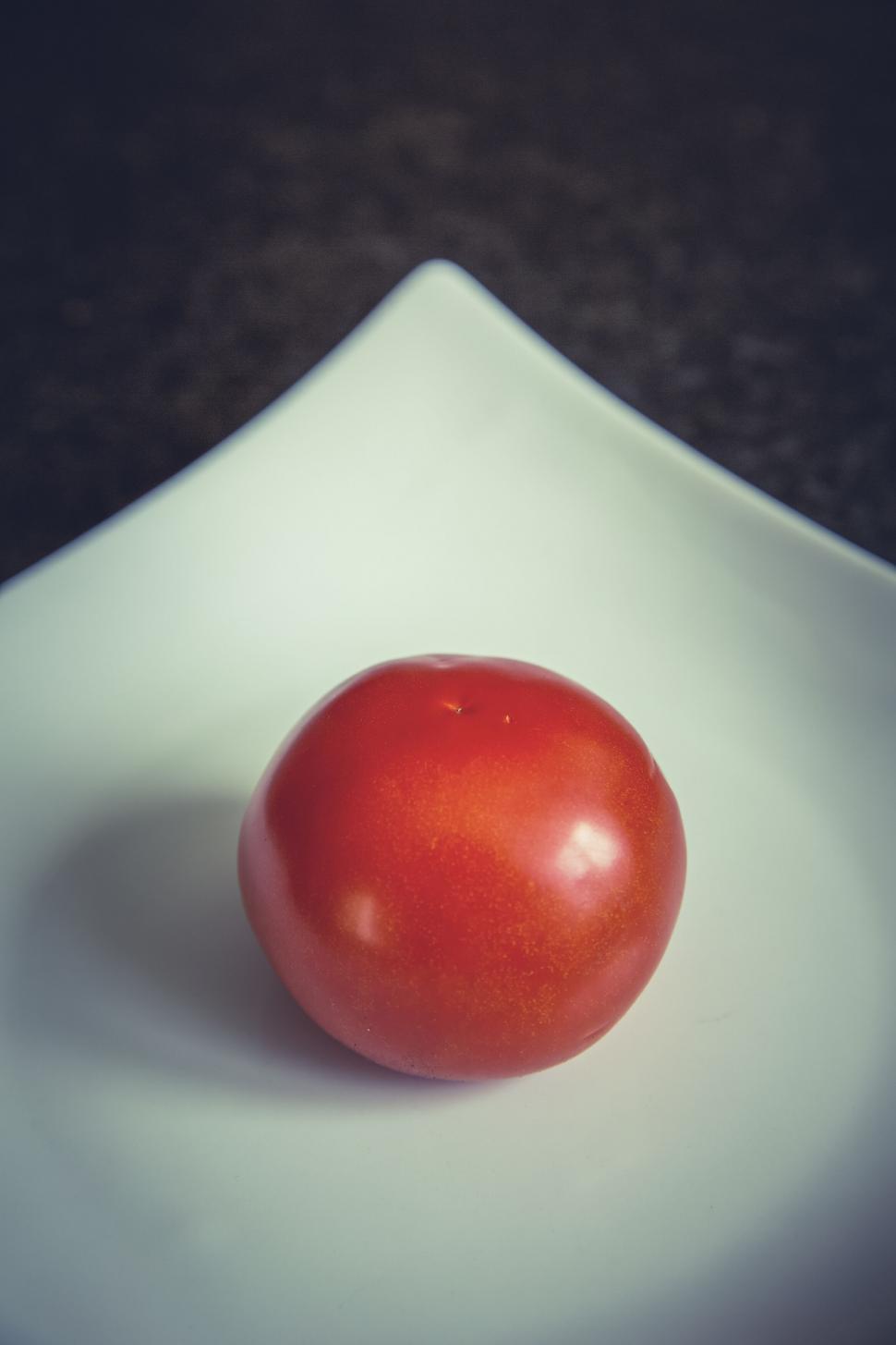 Free Image of Single ripe tomato on a white plate 