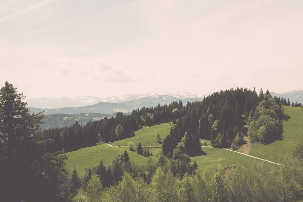 Free Image of Idyllic pastoral landscape with distant Alps 