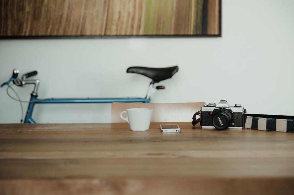 Free Image of Vintage camera and bike in a minimalistic setup 