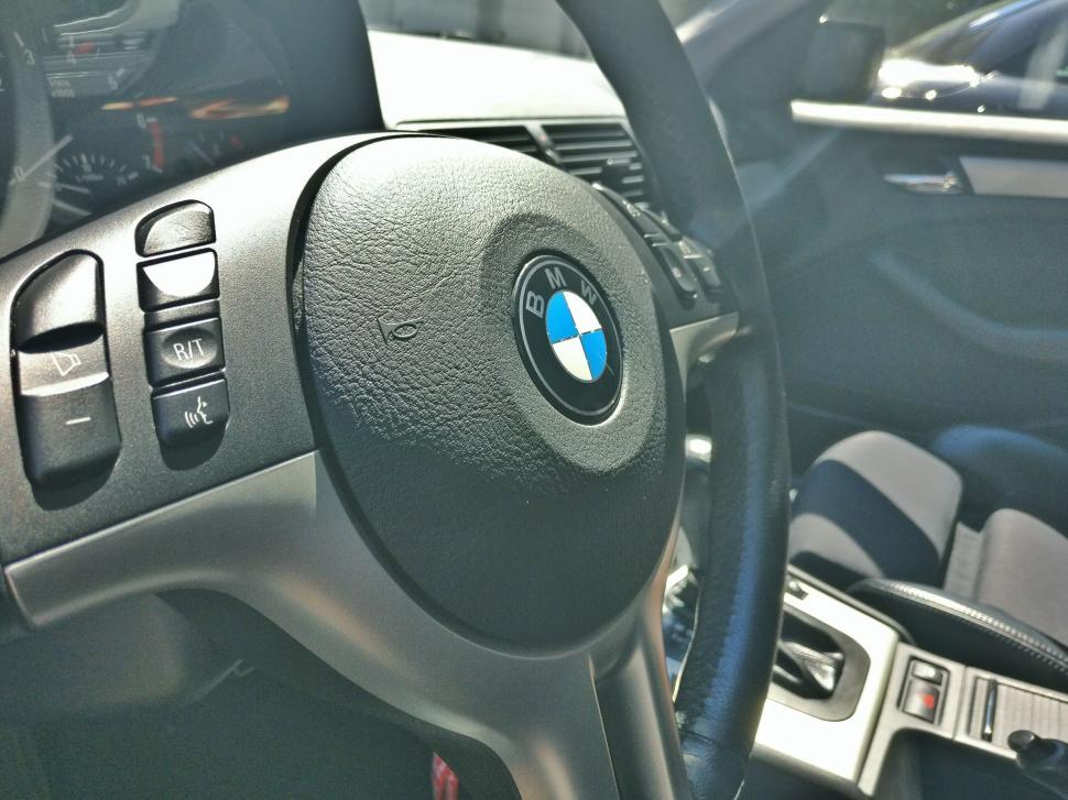 Free Image of BMW car steering wheel and partial dashboard view 