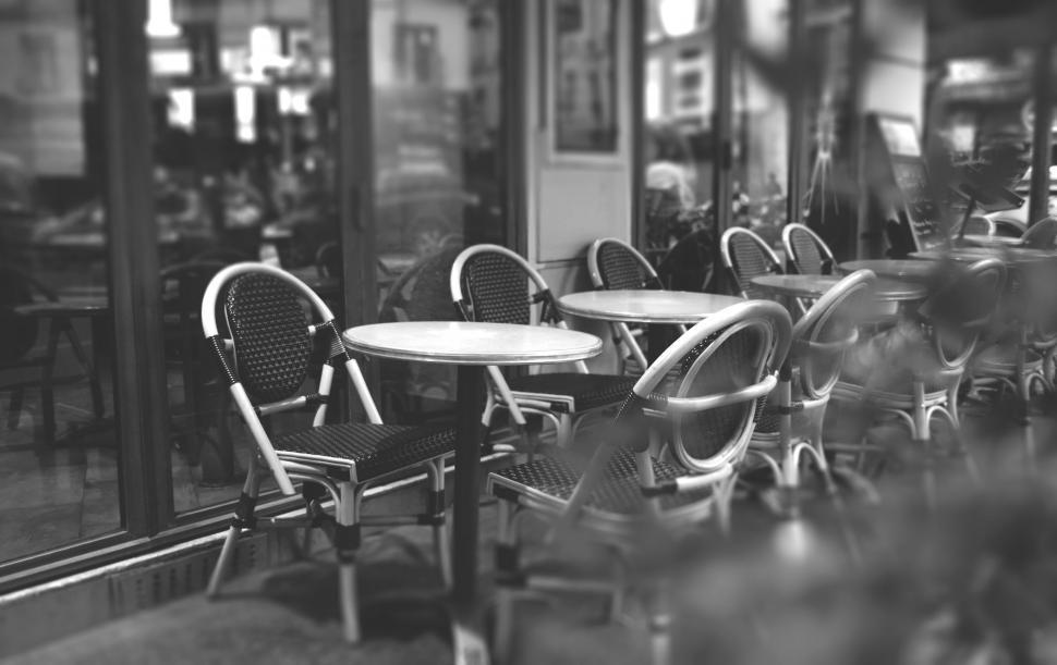 Free Image of Parisian caf? with empty chairs and tables 