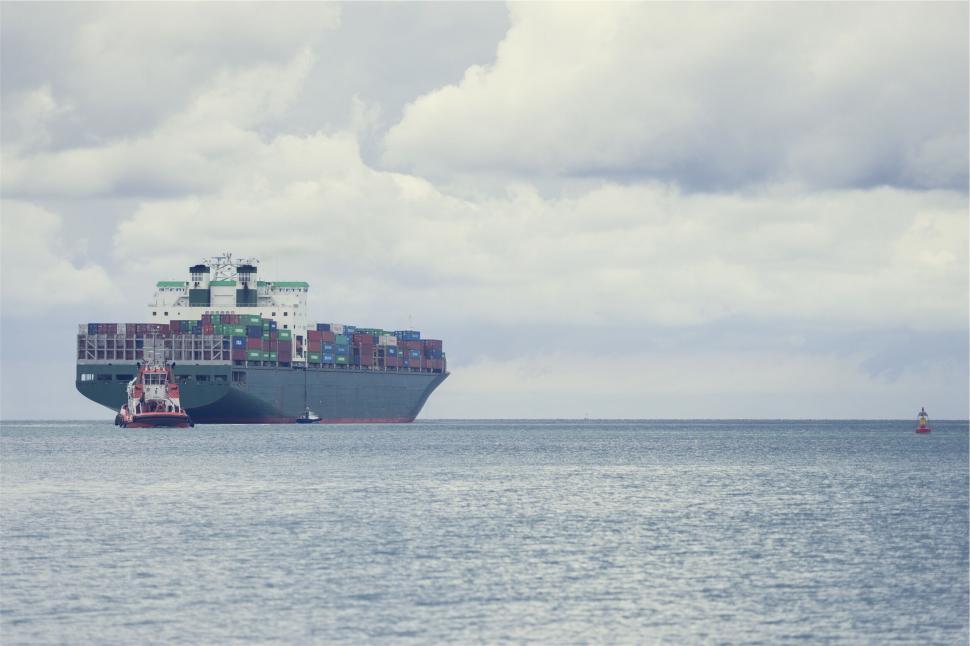 Free Image of Container ship on a cloudy day at sea 