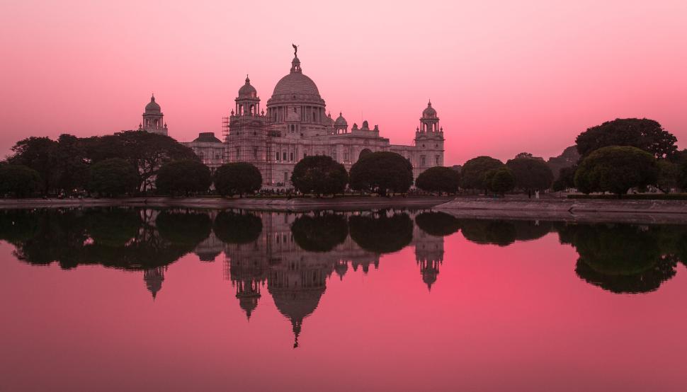 Free Image of Stunning pink sunset over Victoria Memorial 