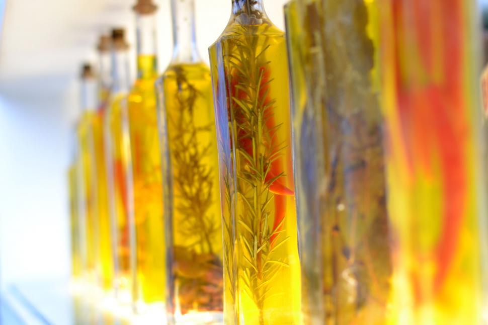 Free Image of Bottles of infused olive oil lined up 