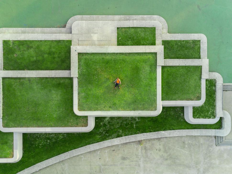 Free Image of Person in a labyrinth-like green space 