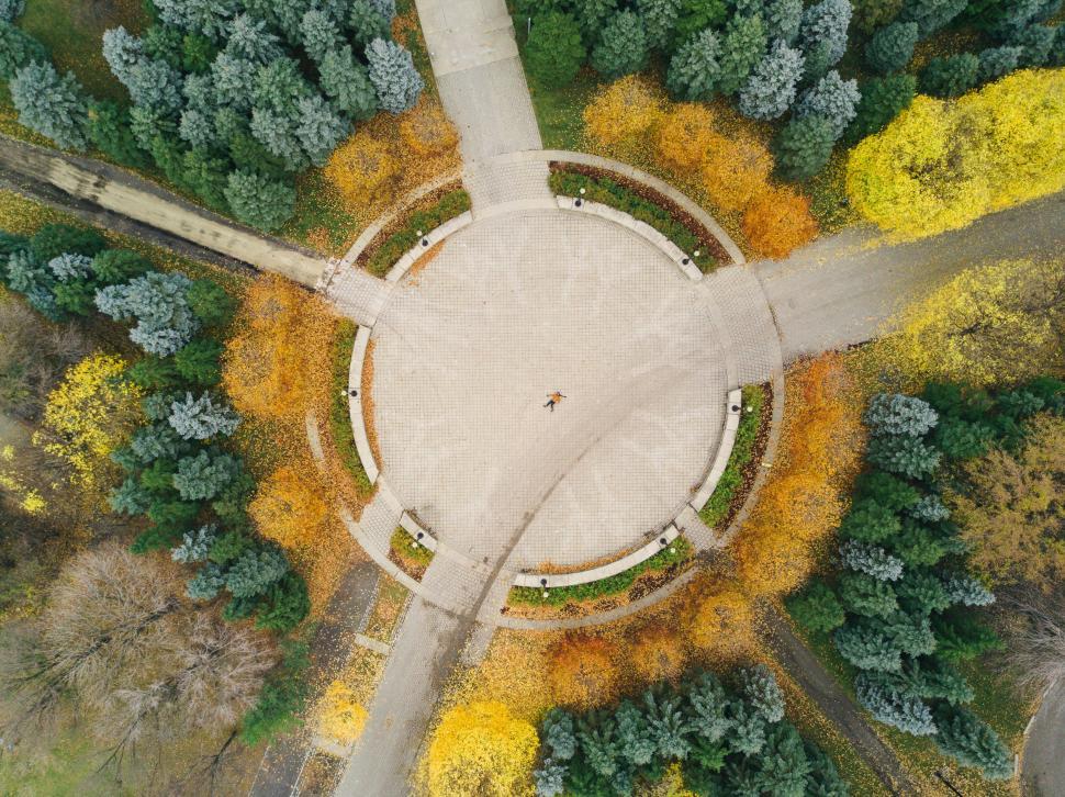 Free Image of Aerial view of circular plaza with autumn trees 