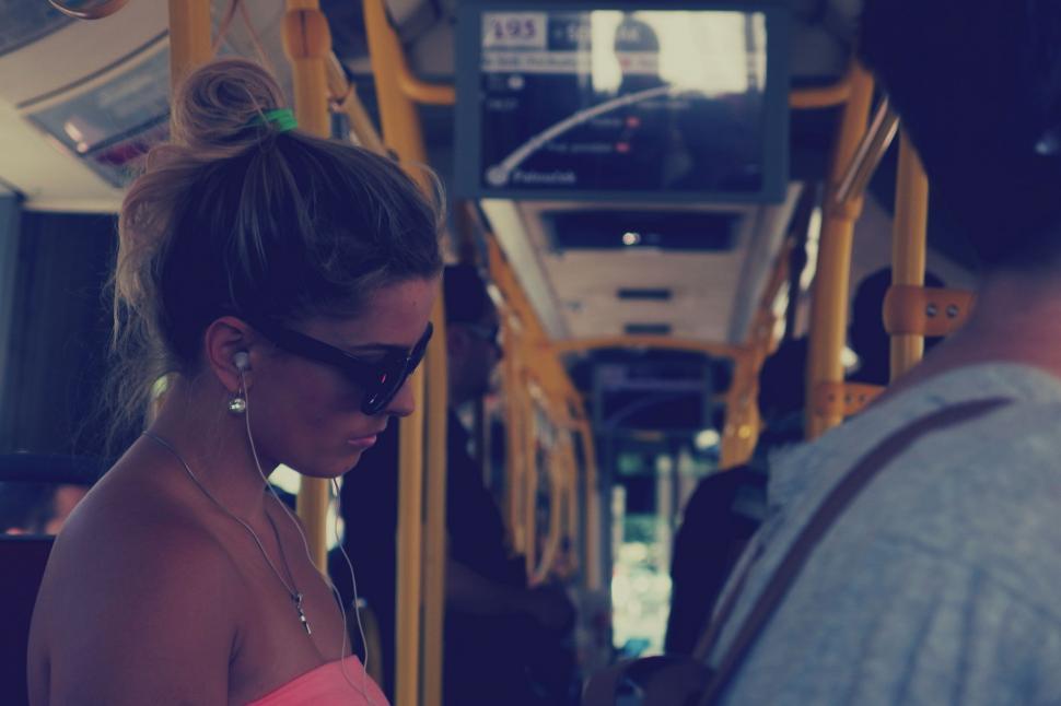 Free Image of Woman traveling by bus on a sunny day 