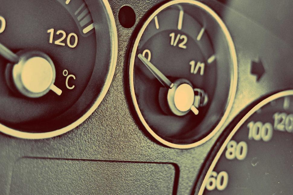 Free Image of Close-up of a car s fuel gauge and dashboard 