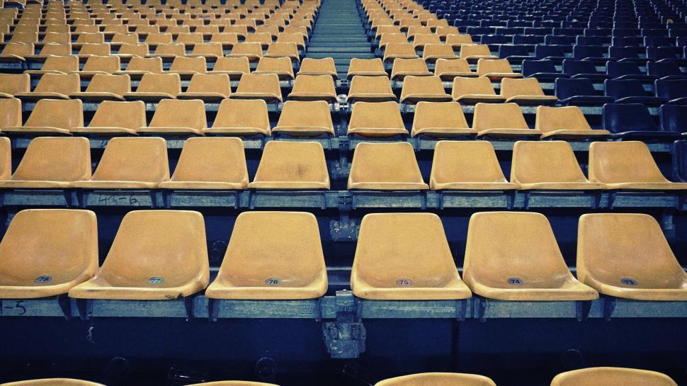 Free Image of Rows of empty yellow seats in large stadium 