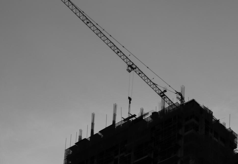 Free Image of Silhouette of a construction site at dusk 
