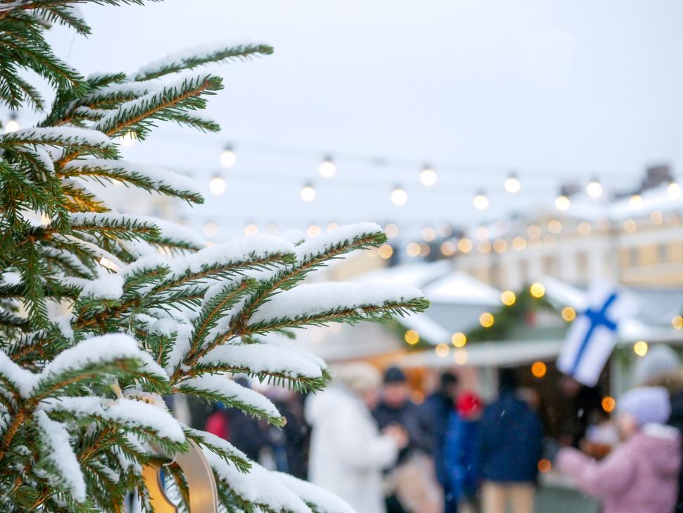 Free Image of Snowy Christmas market scene with fir tree 