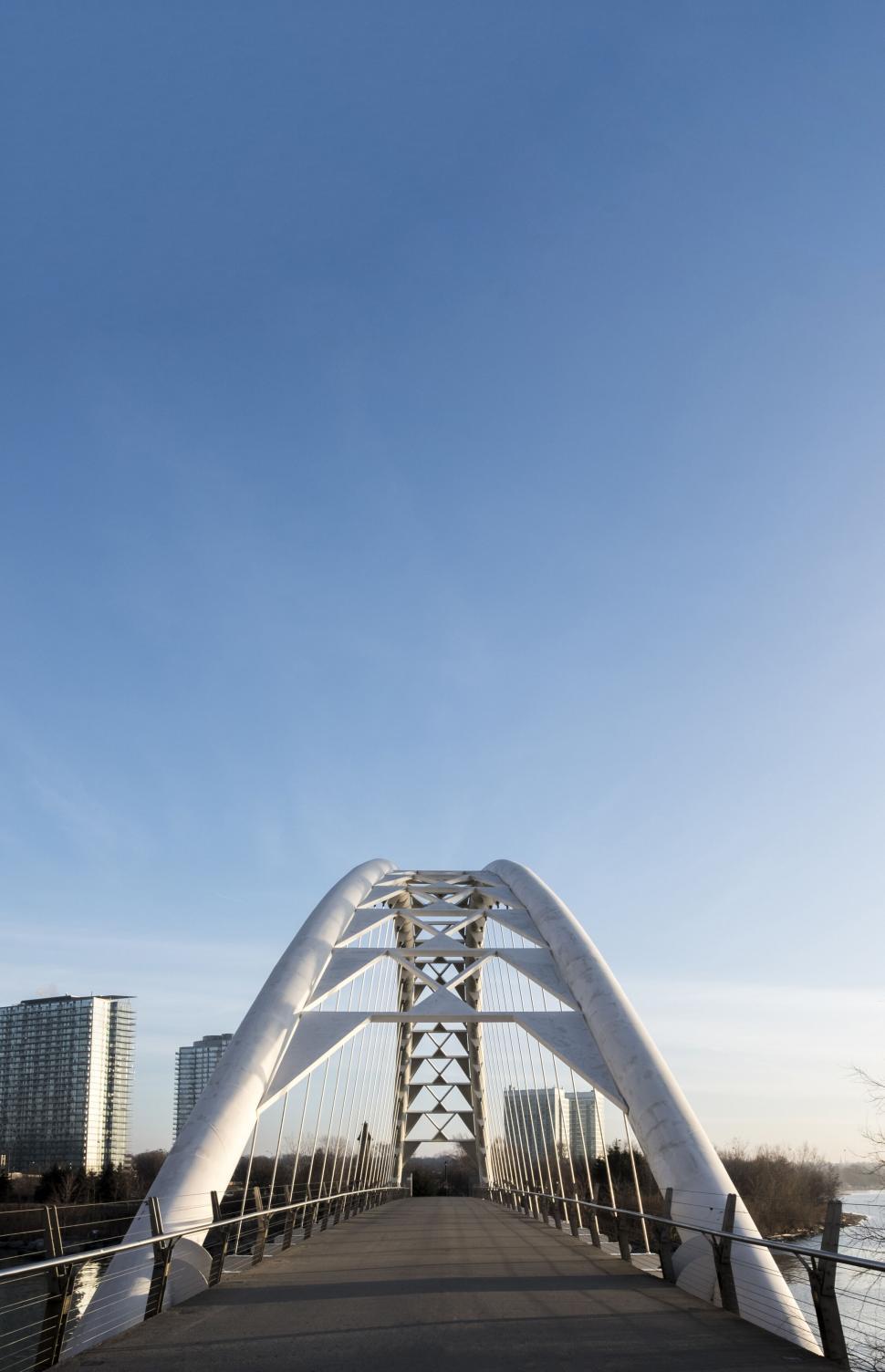 Free Image of Modern pedestrian bridge against a clear sky 