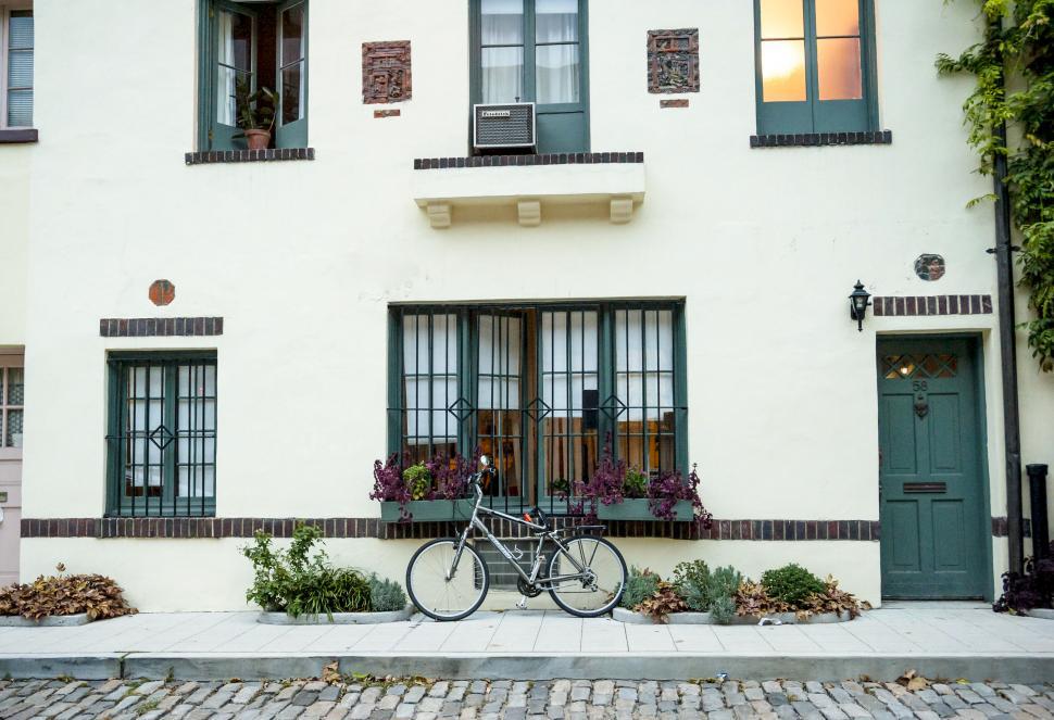 Free Image of Charming bike in front of a vintage house 