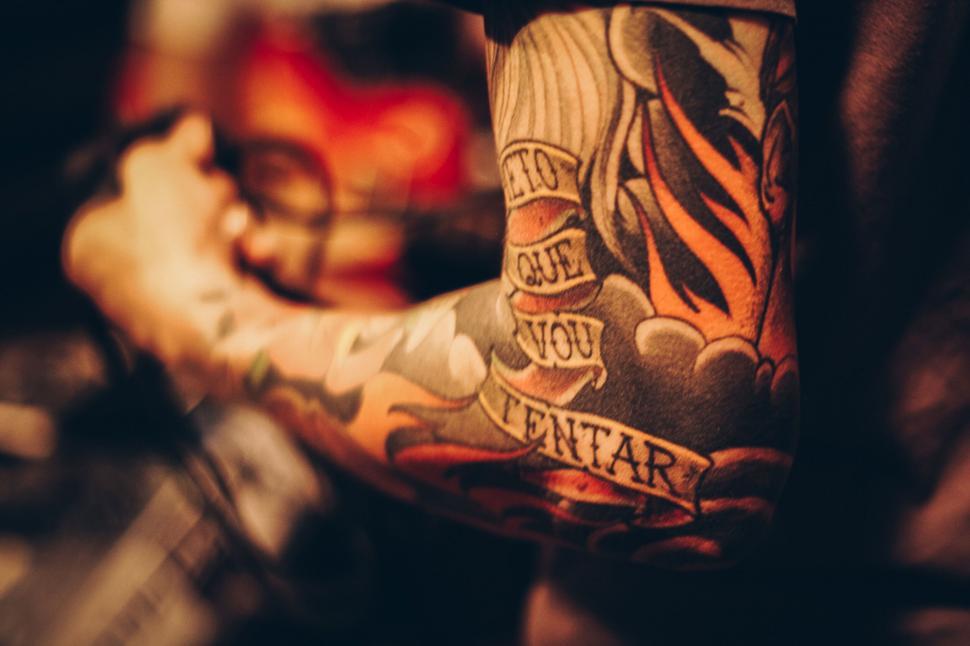 Free Image of Close-up of a colorful tattooed arm 