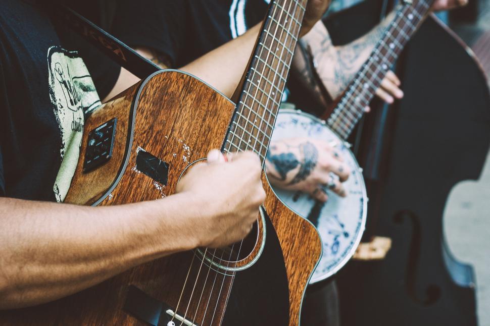 Free Image of Musician playing acoustic guitar 