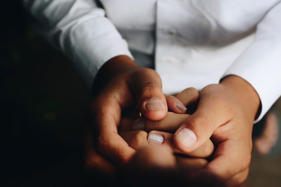 Free Image of Gentle hands holding each other in care 