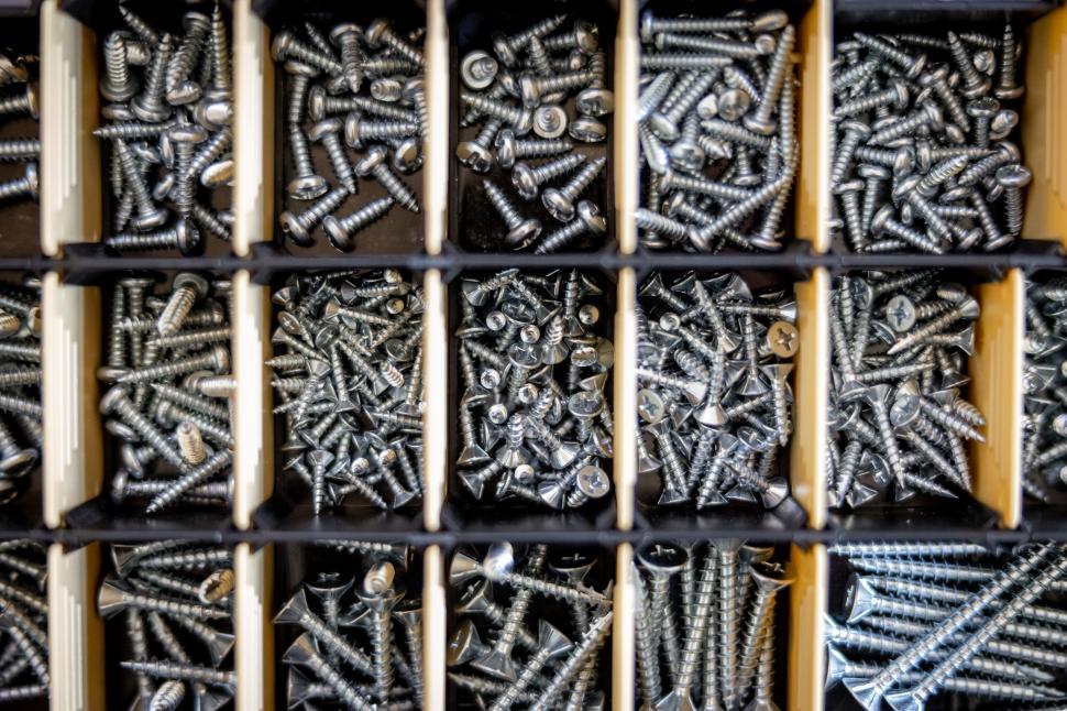 Free Image of Organized screws in storage compartments 