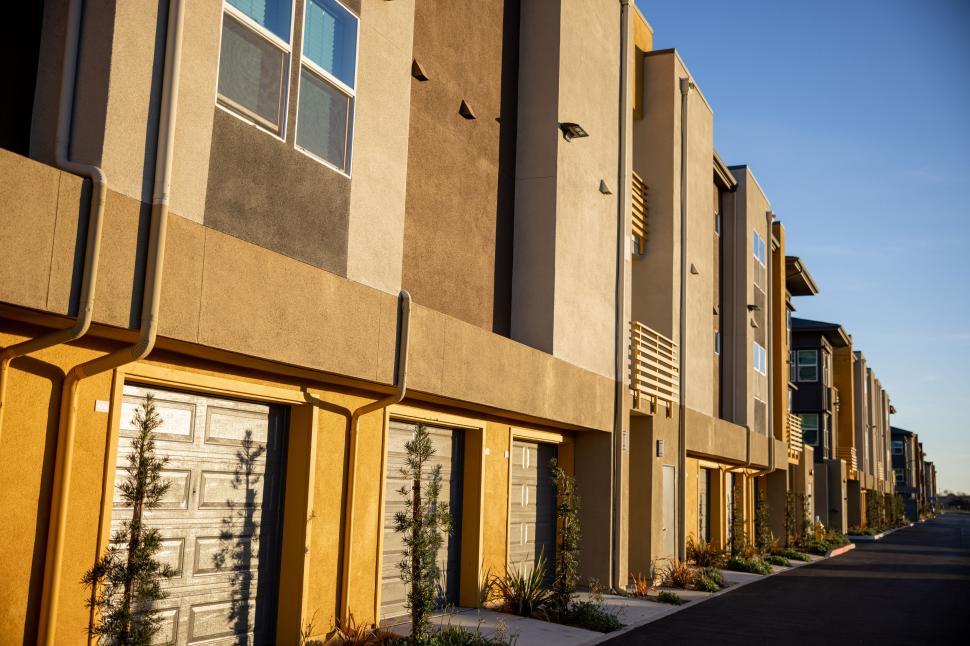Free Image of Modern townhouse buildings at sunset 
