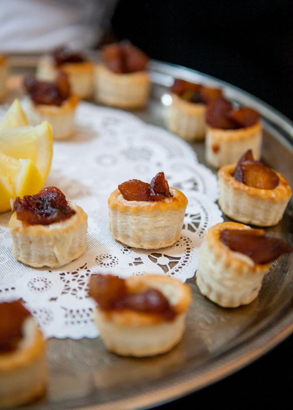 Free Image of Close-up of pastries on a serving tray 