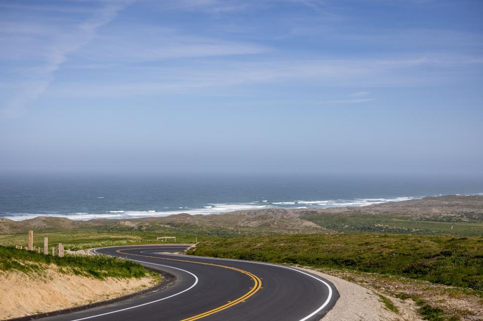 Free Image of Curvy road leading to a seaside view 