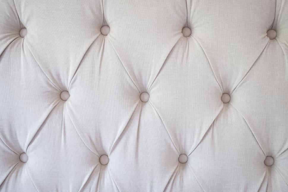 Free Image of Soft textile of a tufted upholstered headboard 