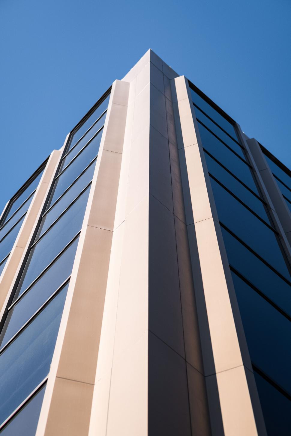 Free Image of Modern skyscraper facade with blue sky 