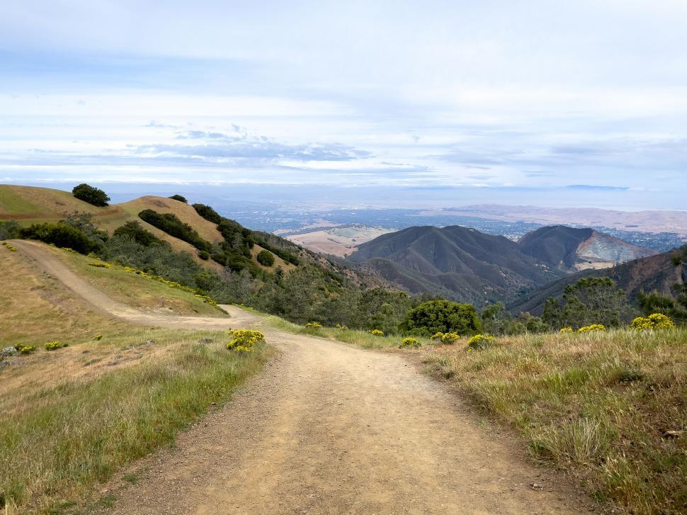 Free Image of Mountain trail with scenic overlook and clear skies 
