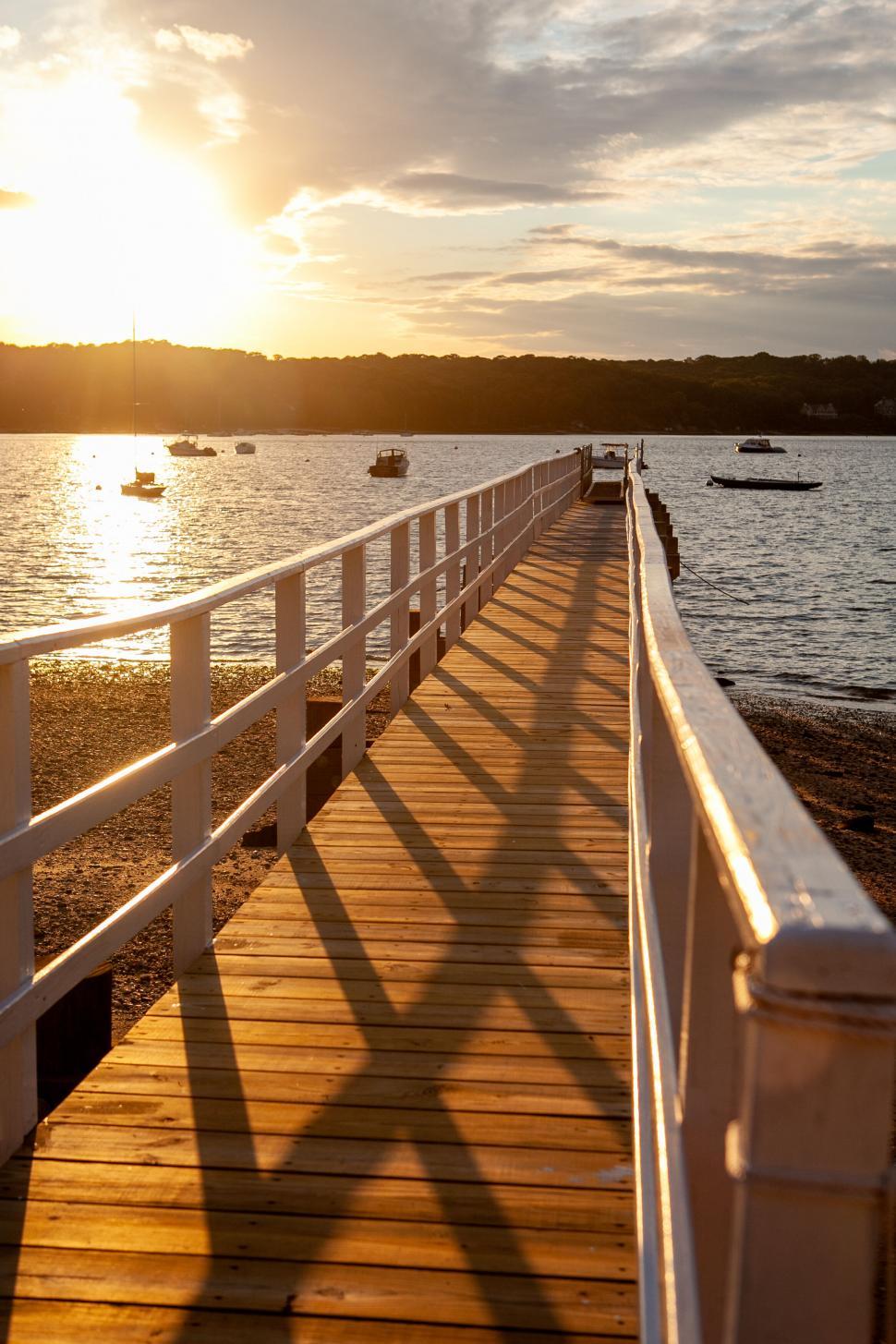 Free Image of Golden sunset on a wooden pier 