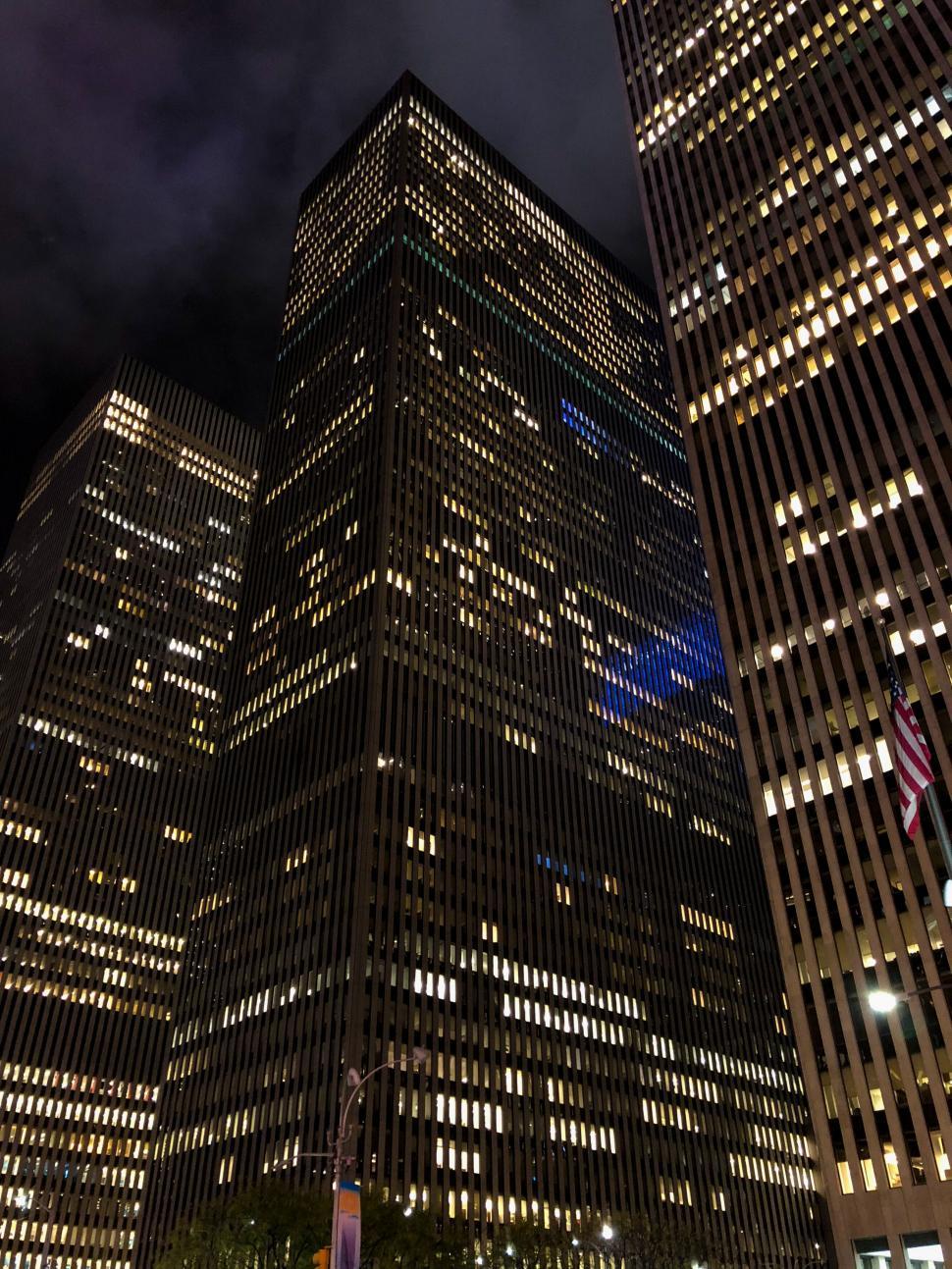 Free Image of Skyscraper facade at night in city 