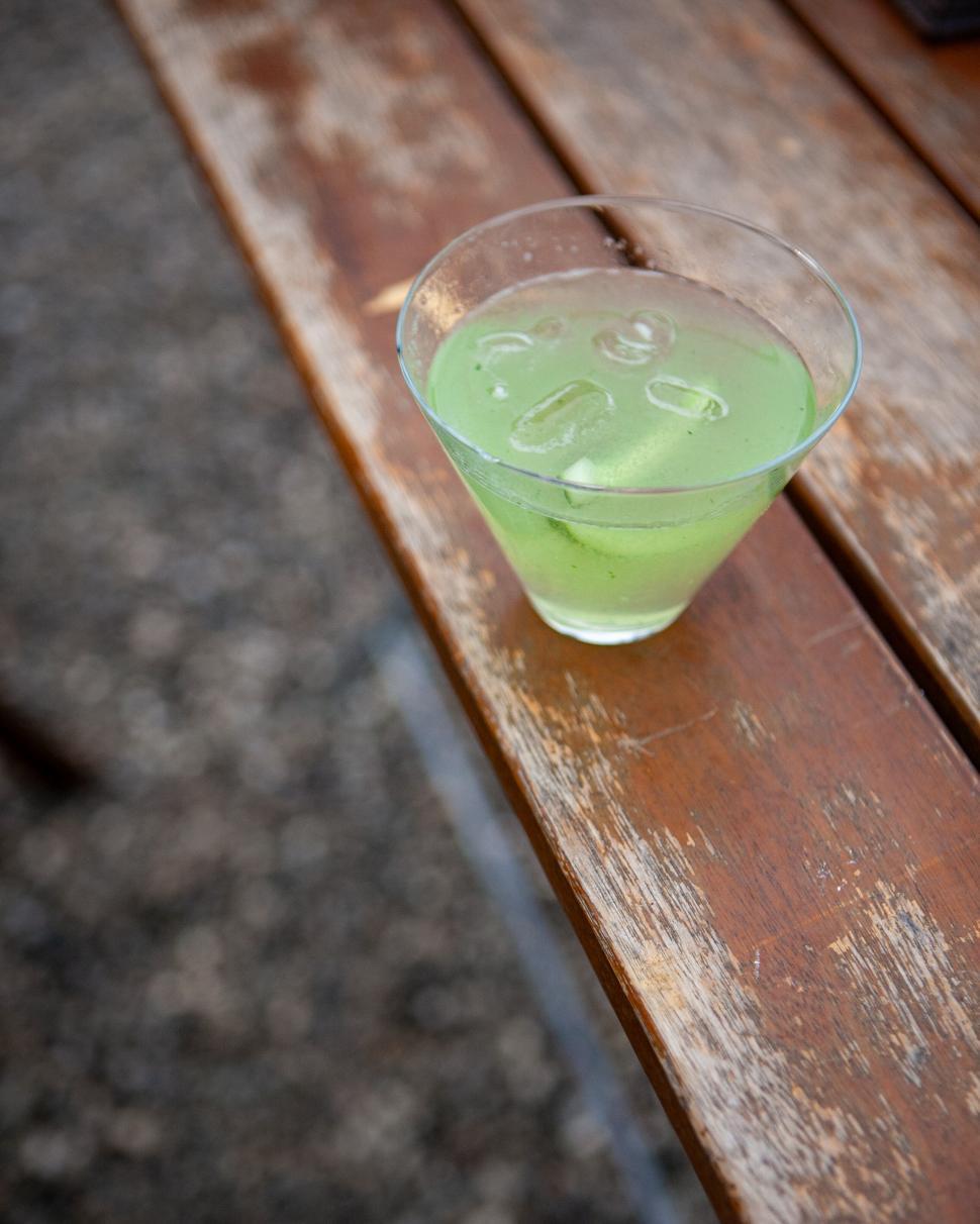 Free Image of Refreshing green cocktail on wooden table 