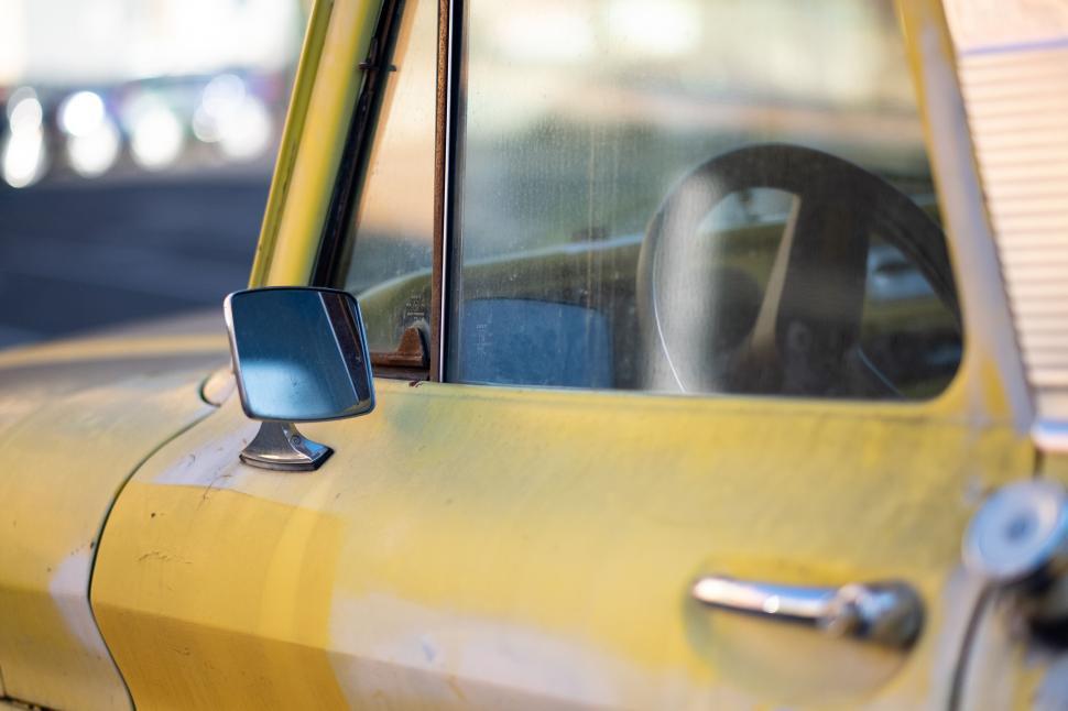 Free Image of Vintage yellow car side view with mirror 