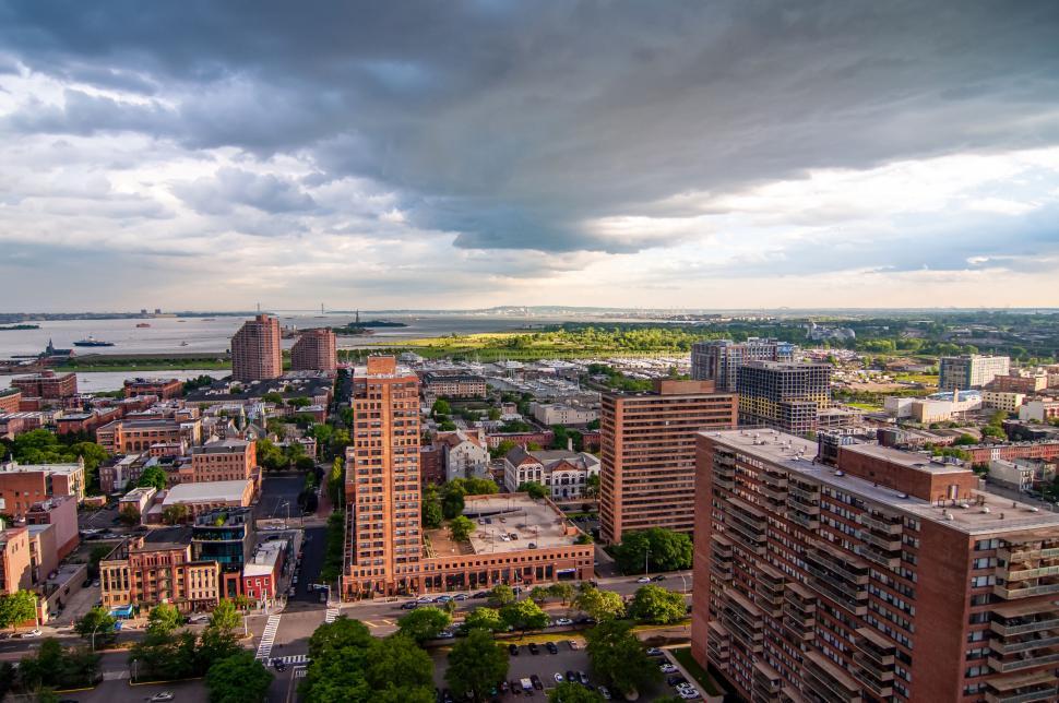 Free Image of Urban landscape with stormy skies overhead 