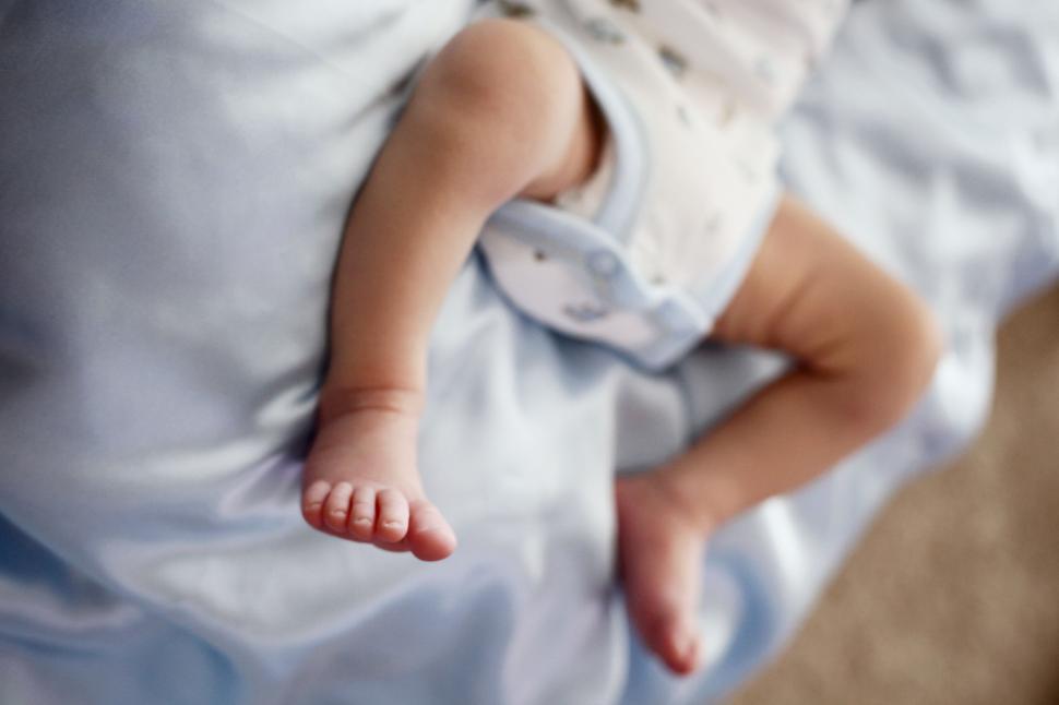 Free Image of Close-up of baby s feet in soft focus 