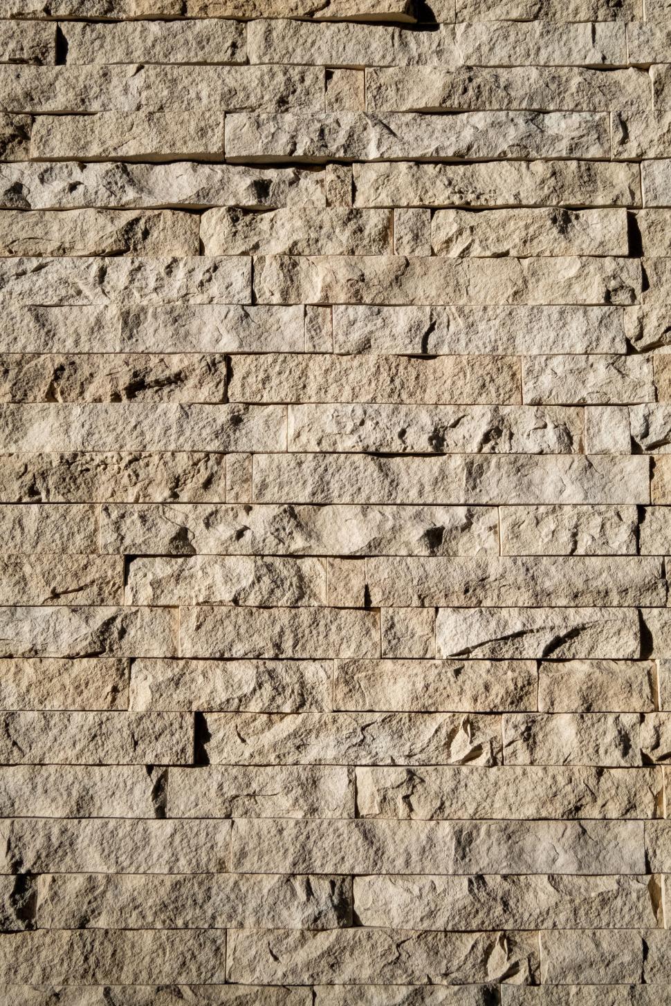 Free Image of Close-up texture of beige stone wall 