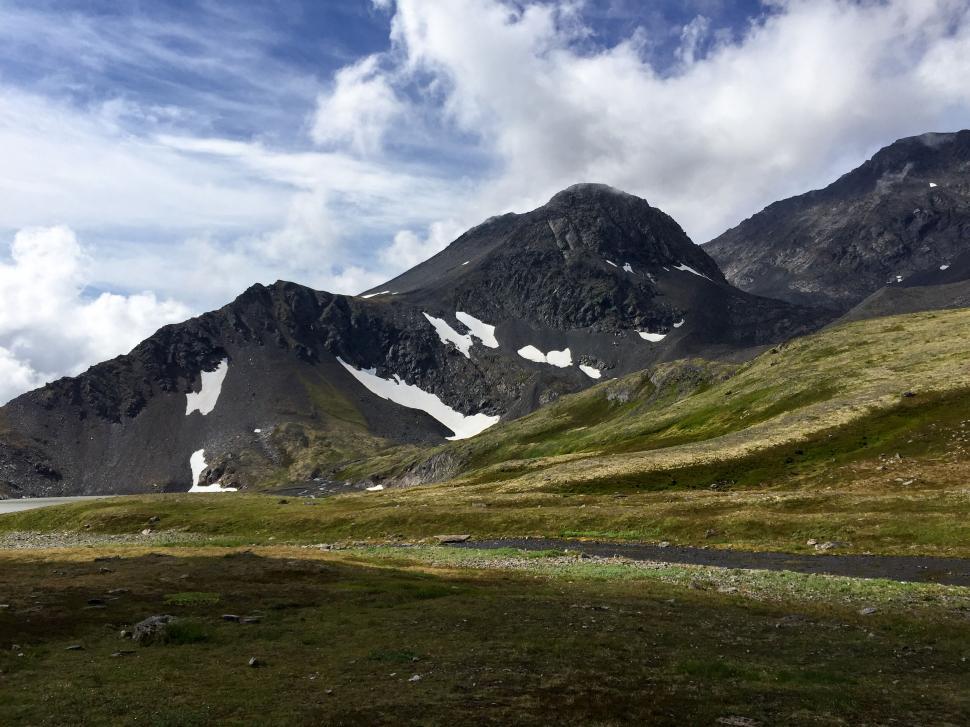 Free Image of Mountain landscape with snowy peaks and green valley 