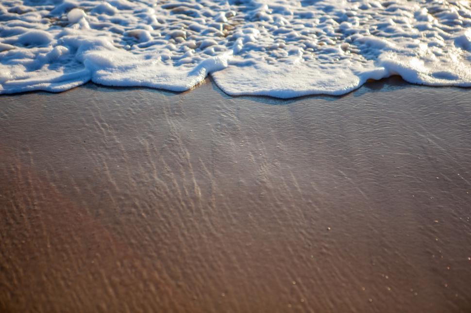 Free Image of Close-up of ocean waves meeting shore 