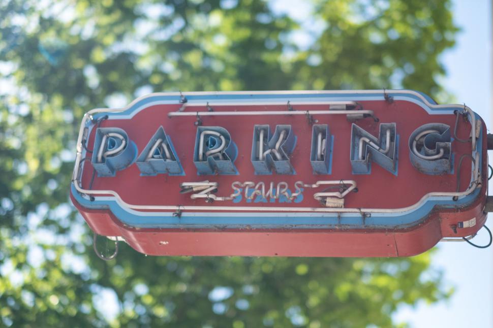Free Image of Vintage neon parking sign with peeling paint 