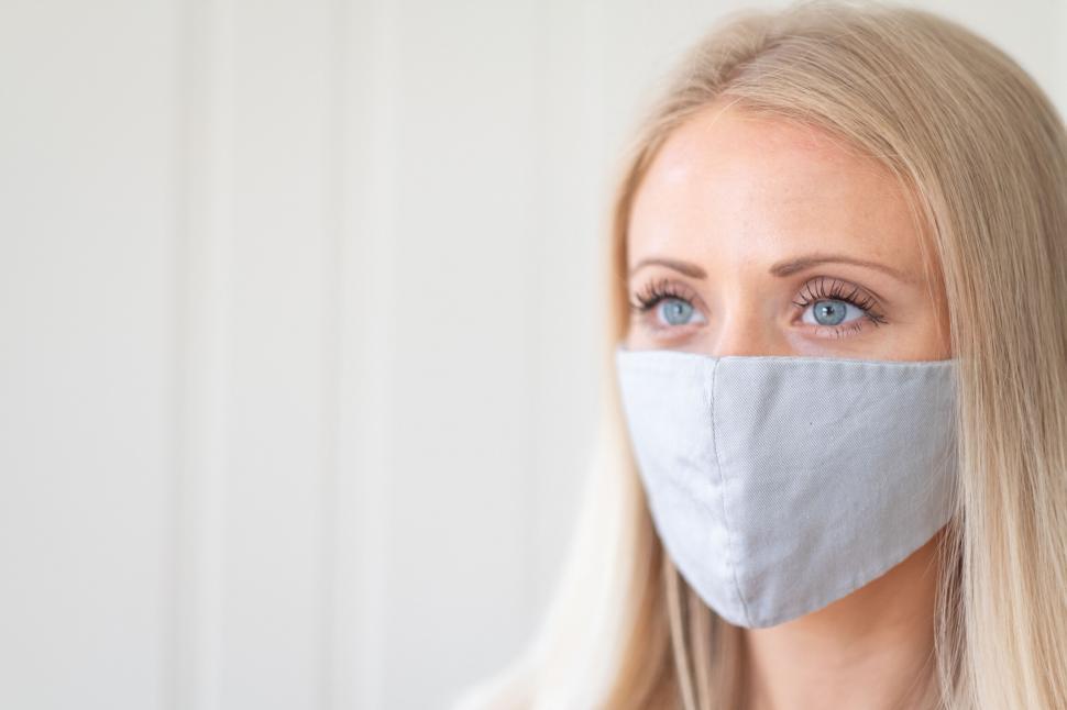 Free Image of Blonde woman wearing a fabric face mask 