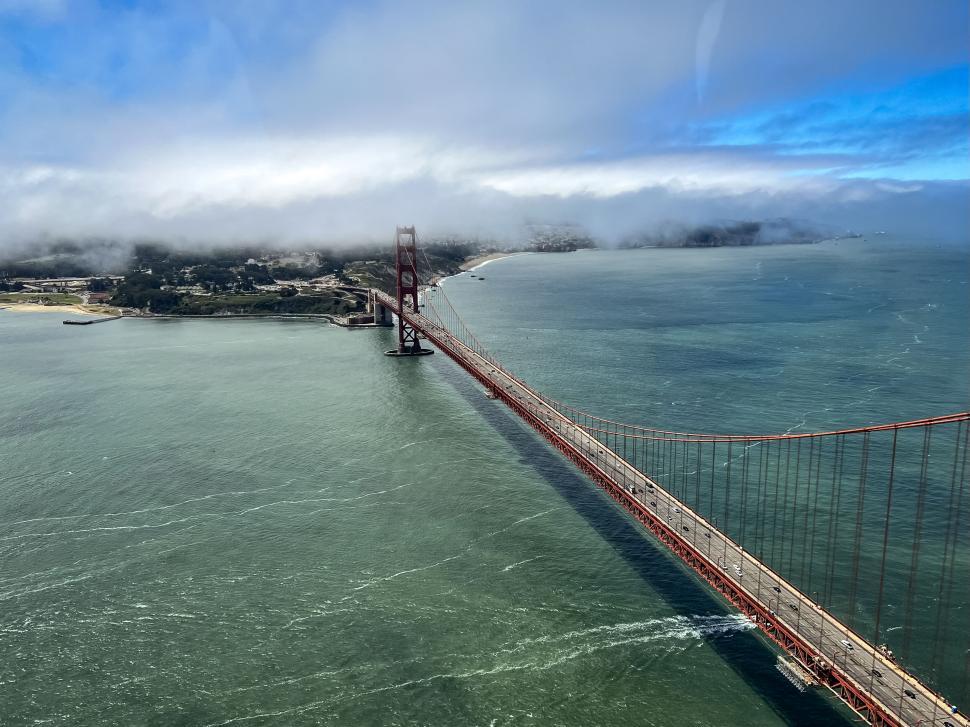 Free Image of Aerial view of the Golden Gate Bridge and fog 