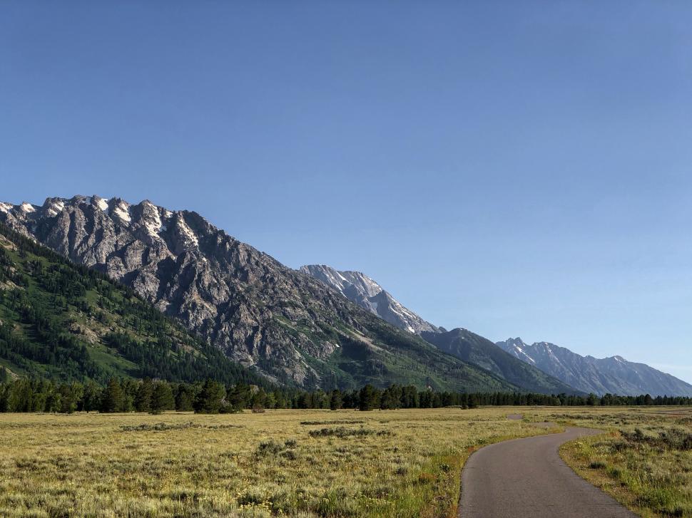 Free Image of Mountain range with road leading towards them 