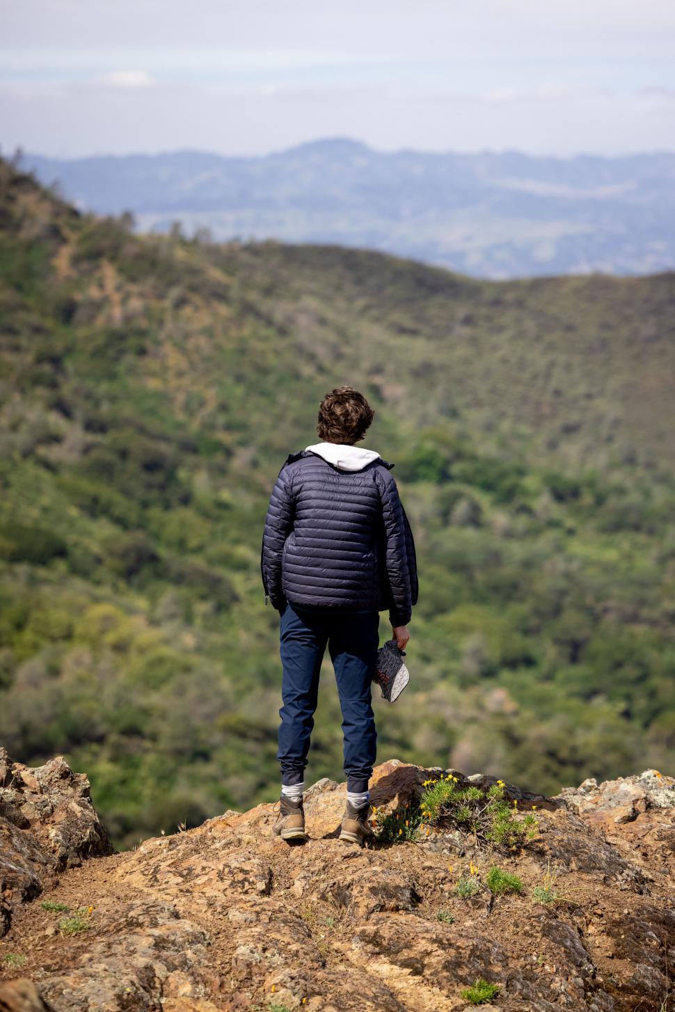 Free Image of Man looking at mountainous landscape 