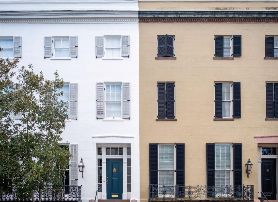 Free Image of Symmetrical townhouses with shutter windows 