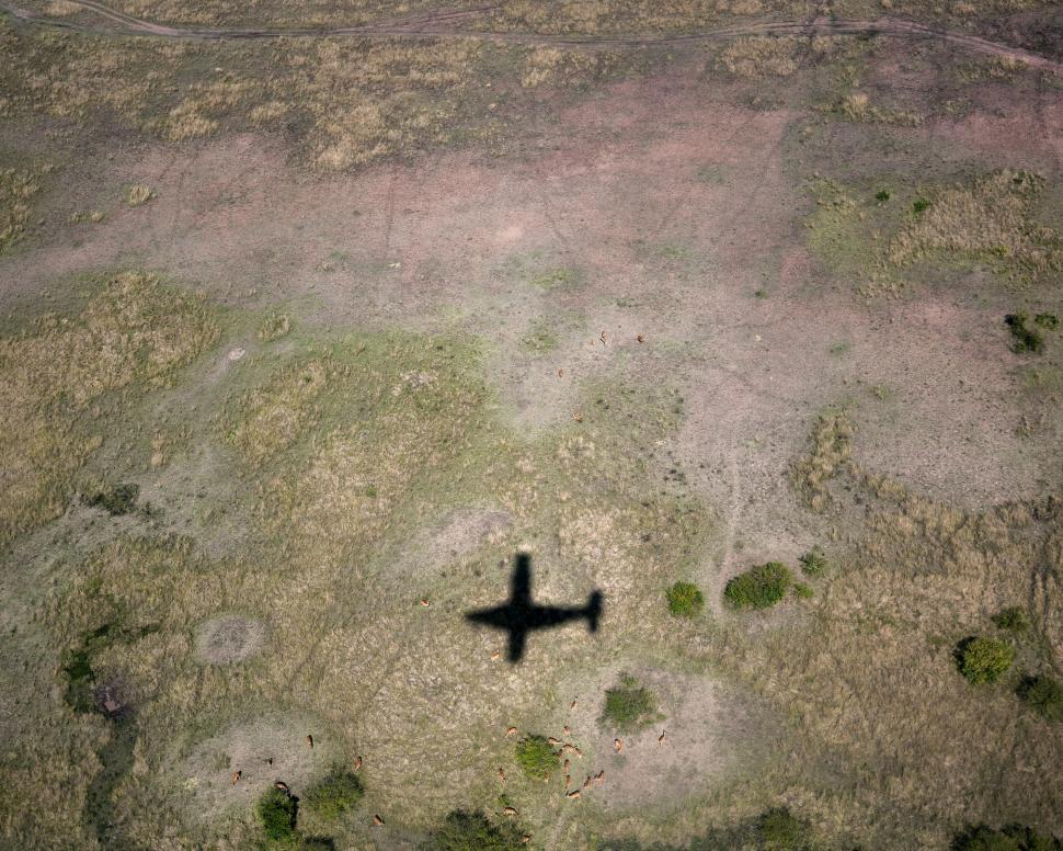 Free Image of Aerial View of Airplane s Shadow on Terrain 