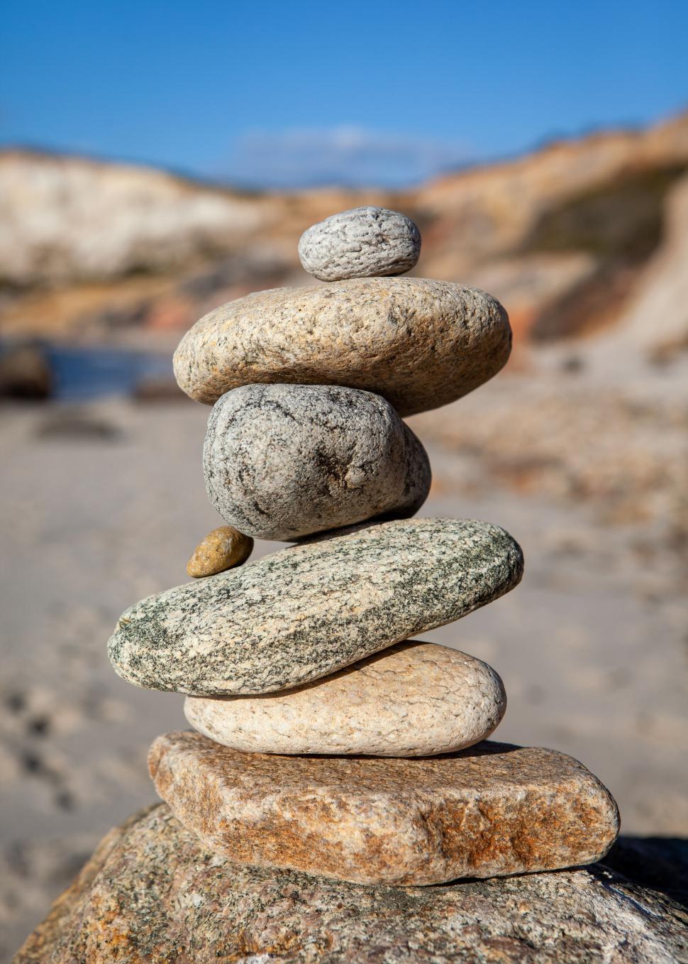 Free Image of Stack of balanced stones on beach 