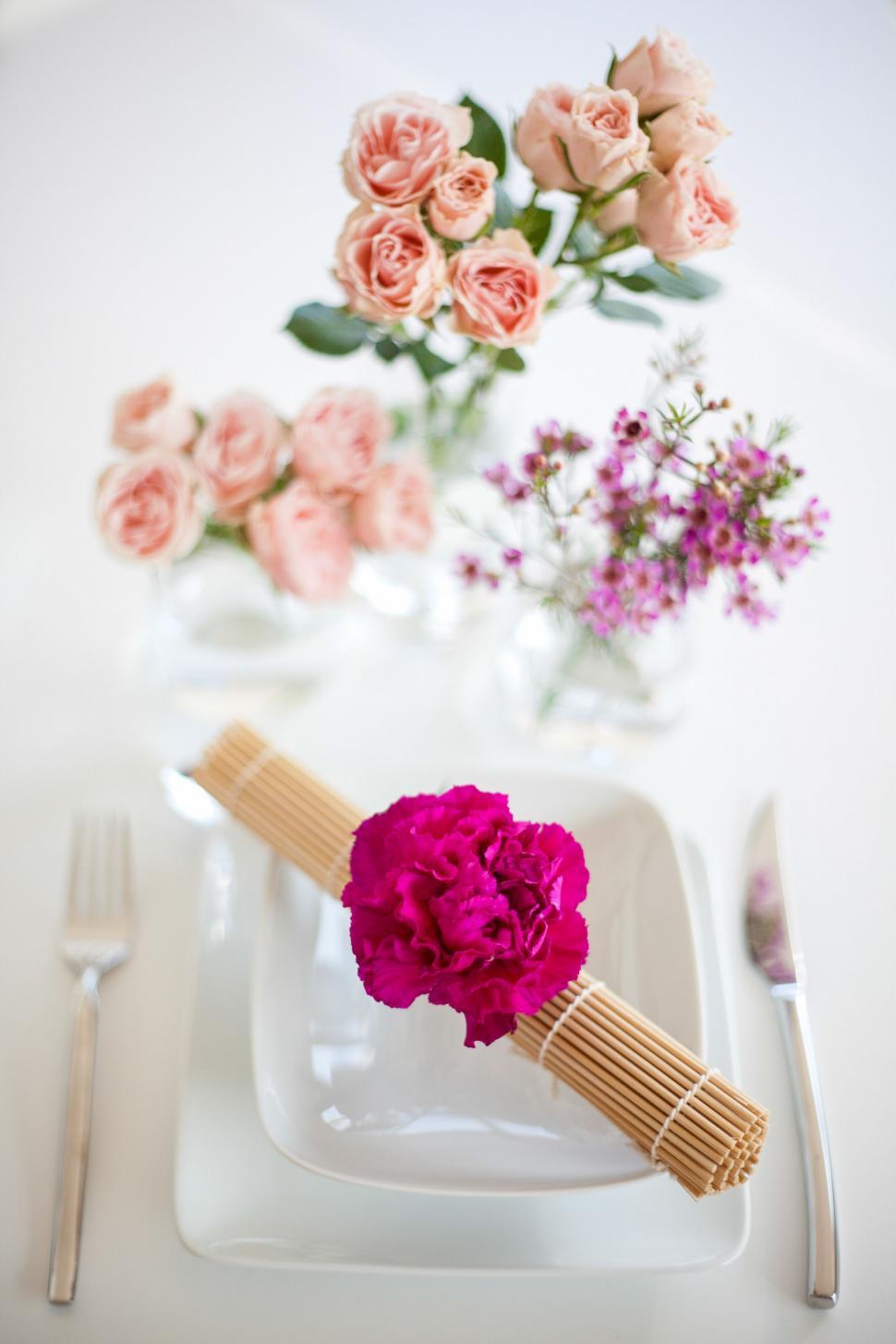 Free Image of Elegant table setting with flowers and pasta 